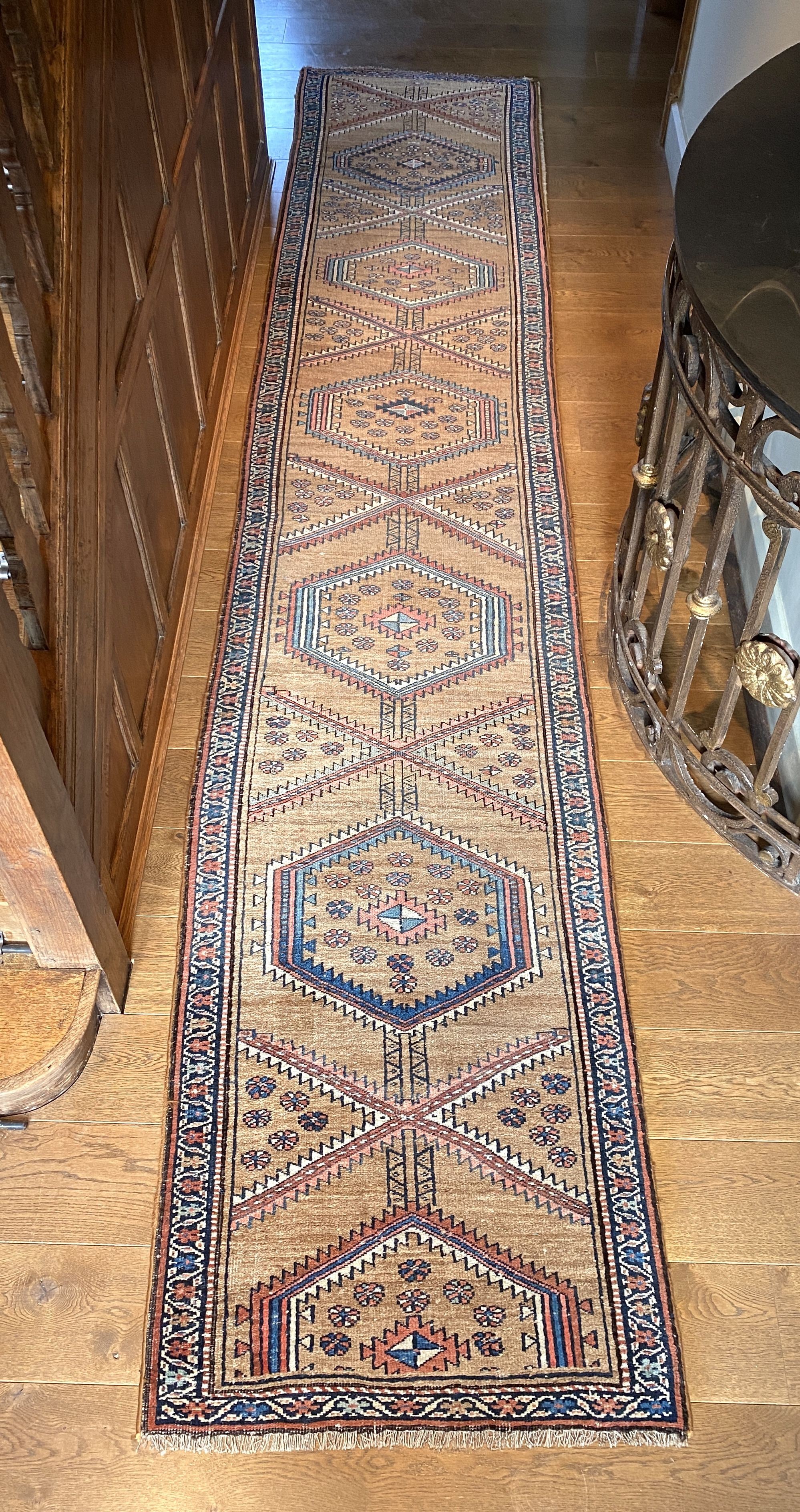 A Caucasian style pale brown ground runner, with hexagonal motifs, 382 x 77cm